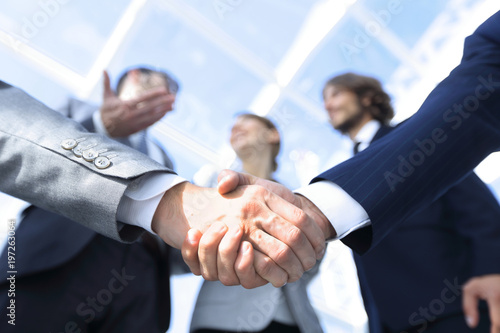 Фотография in the foreground.handshake of business partners
