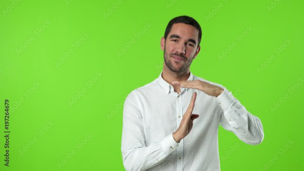 Young man with a gesture of break time Young man with a gesture of break time