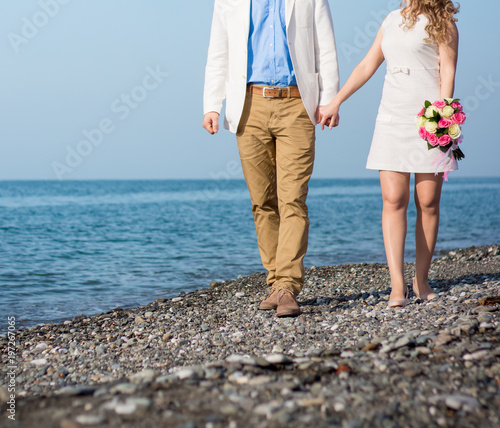 The bride and groom on the beach © 0635925410