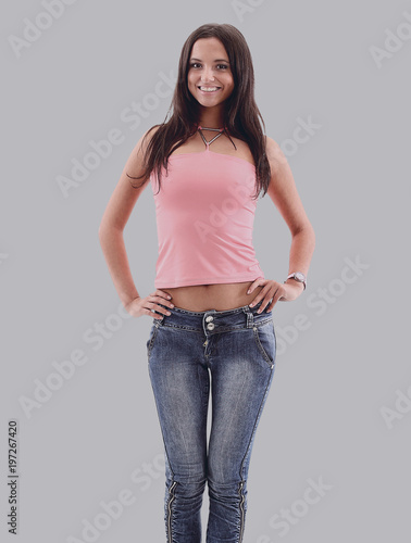 Picture of a young casual woman standing isolated on white