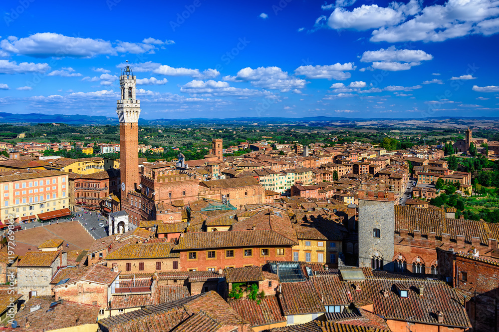 Aerial view of Siena with Campo Square (Piazza del Campo), Palazzo Pubblico and Mangia Tower (Torre del Mangia) in Siena, Tuscany, Italy