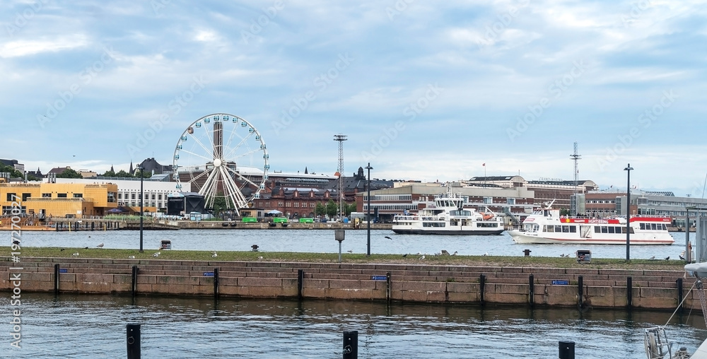 HELSINKI, FINLAND - AUGUST 20, 2017: Sky Wheel and boats in the port of Helsinki, Finland
