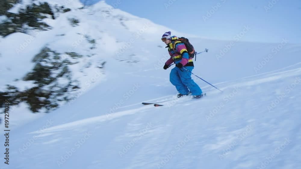 Slow motion skier jumps from the top of the mountain freeride Slow motion skier jumps from the top of the mountain freeride