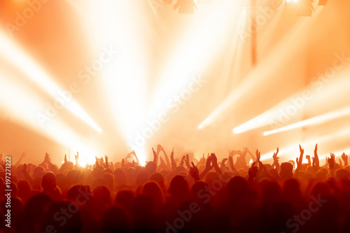 concert crowd in front of bright stage lights