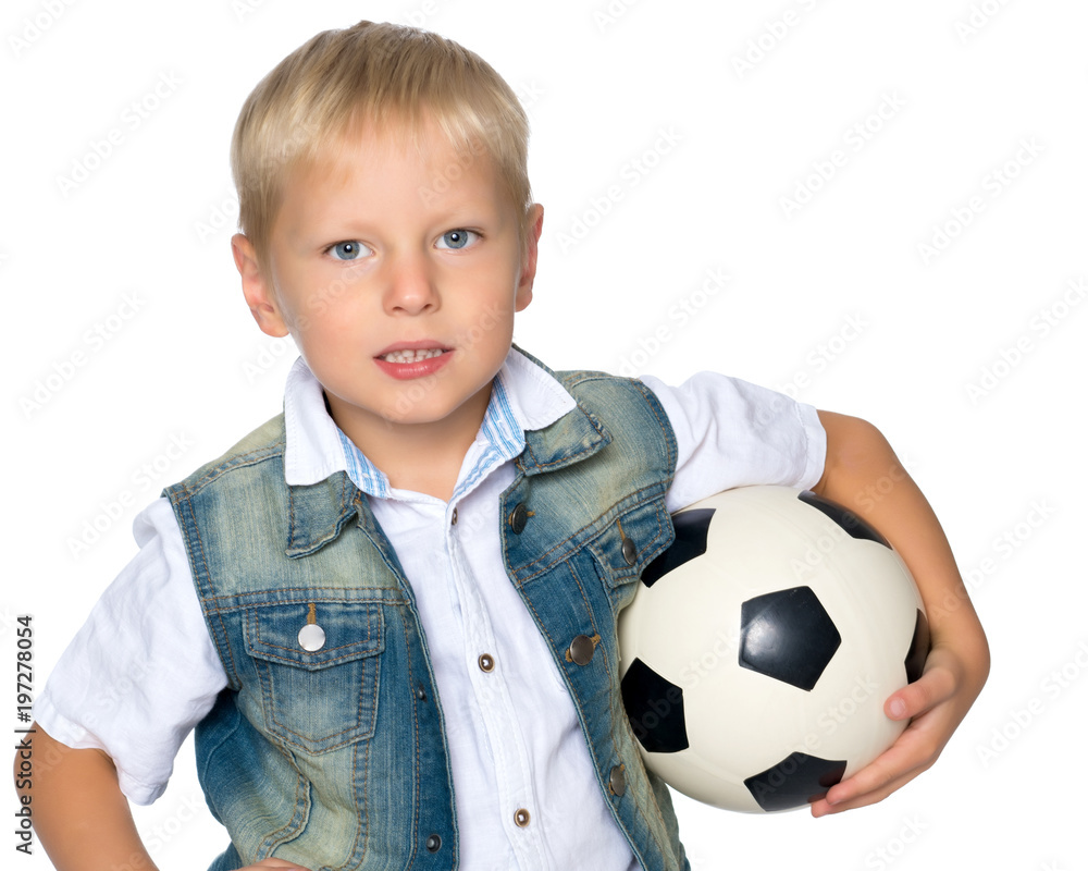 A little boy is playing with a ball. A little boy is playing with a ball.