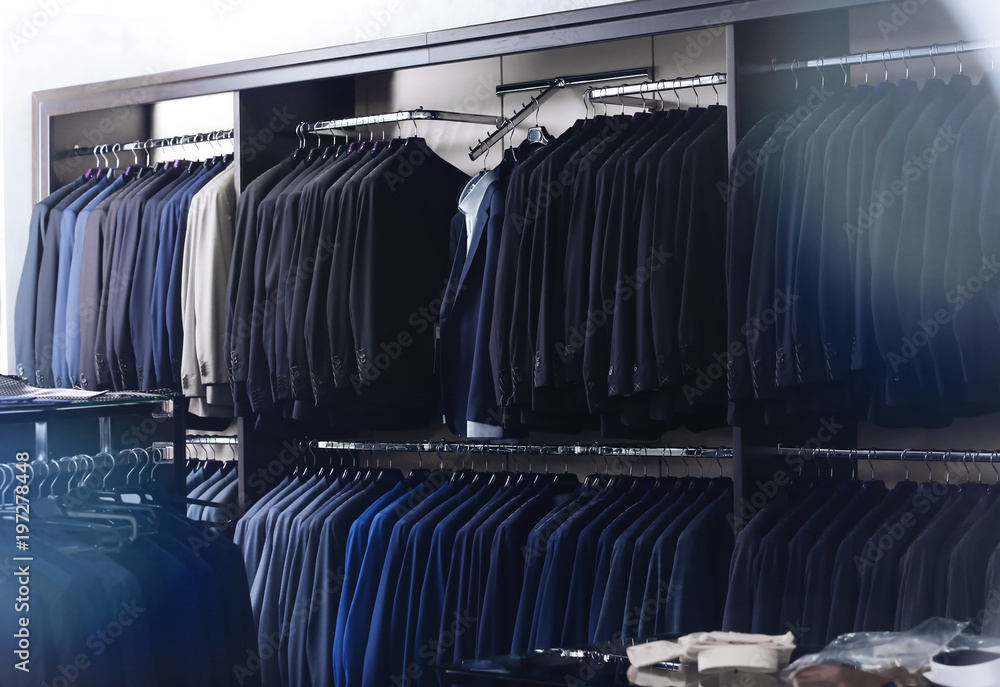 Fototapeta premium Stylish clothes at menswear store