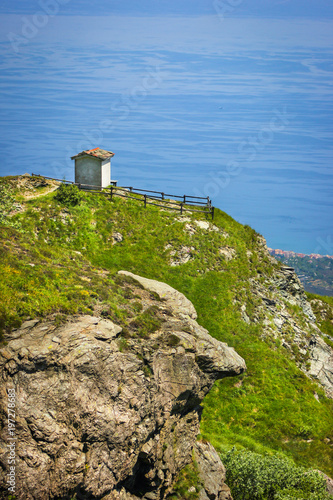 Alpine landscape with small soldiers monument facing the Mediteranean Sea in Beigua National Geopark, Liguria, Italy