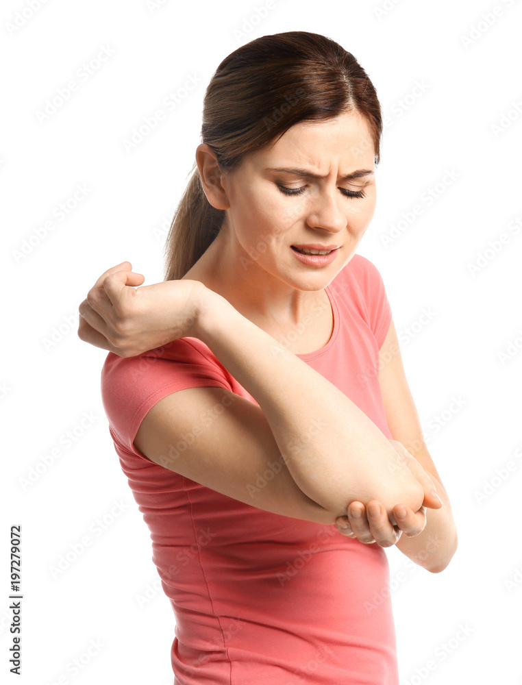 Young woman suffering from elbow pain on white background Young woman suffering from elbow pain on white background
