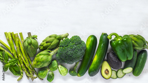 Green vegetables  on a white background. Healthy food. Top view, copy space