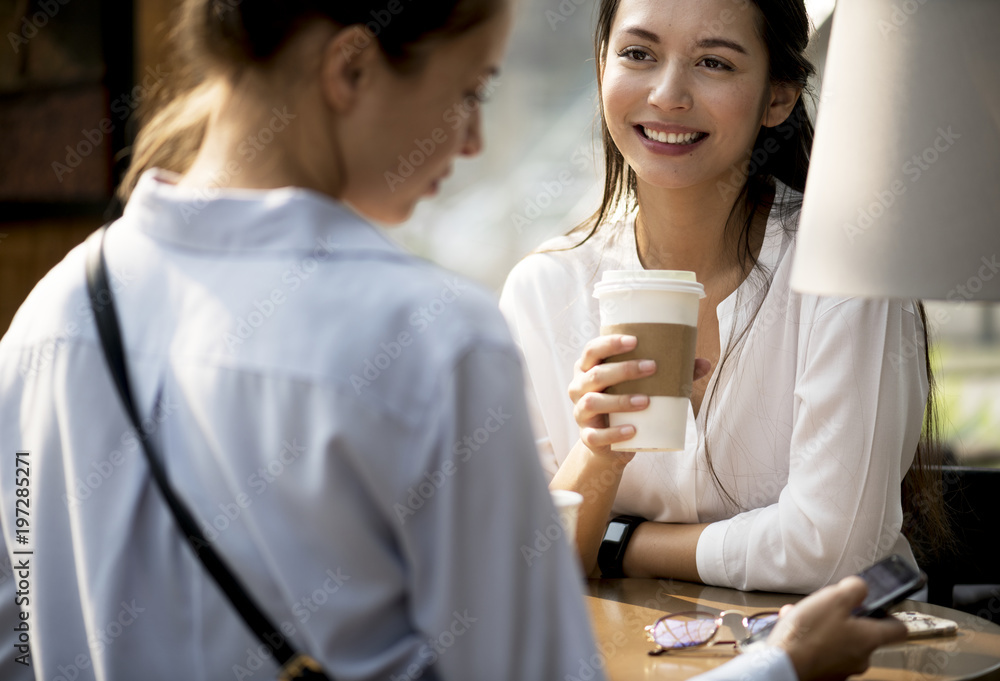 Women enjoying some morning coffee Women enjoying some morning coffee
