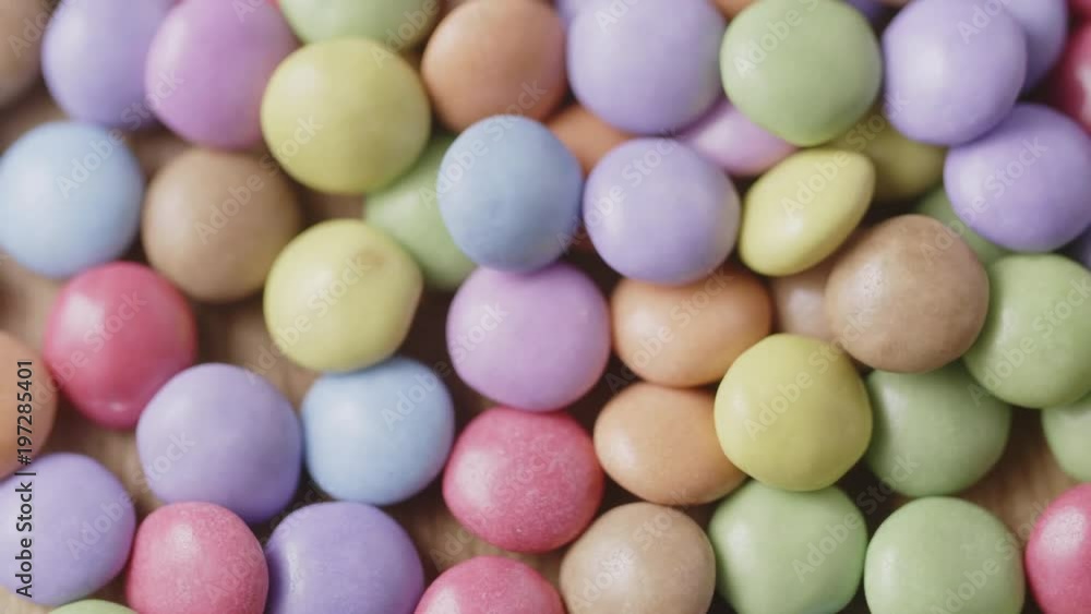 Closeup Dolly Shot Of Colorful Chocolate Candies On Table