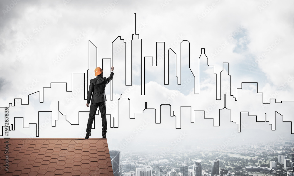 Man architect draw silhouette of modern city on blue sky. Mixed Man architect draw silhouette of modern city on blue sky. Mixed