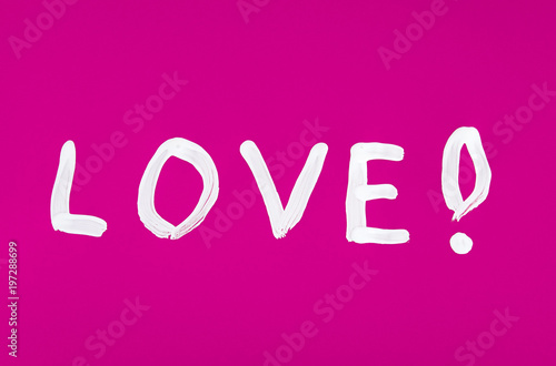Love word painted on the pink background