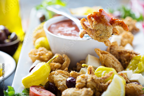 Fried calamari with marinara sauce photo