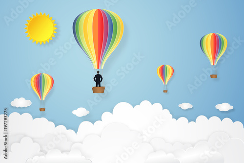 Businessman in the colorful hot air balloon and sunny under blue sky as paper art  craft style and business new year start up concept. vector illustration.