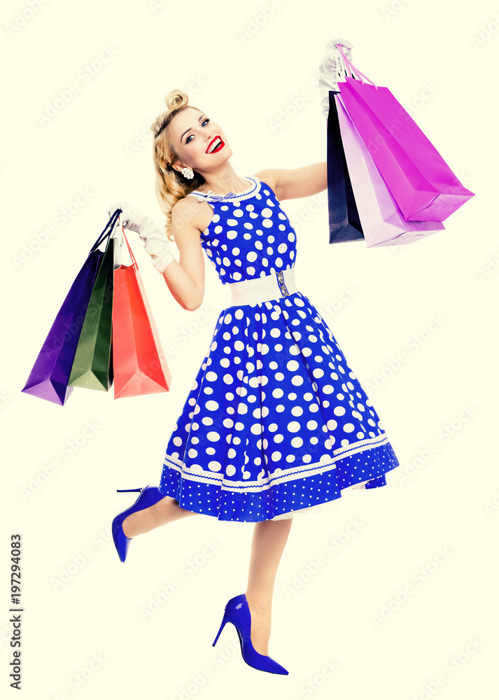 woman in pin-up style holding shopping bags