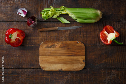 Cutting board fresh vegetables dark wooden table top view