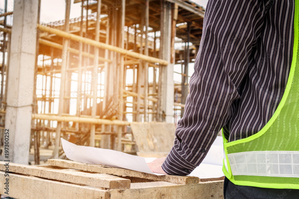 professional engineer worker at the house building construction site professional engineer worker at the house building construction site