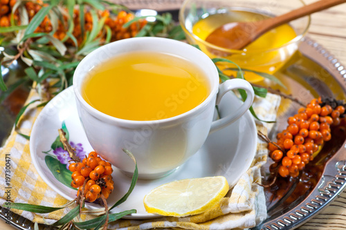 Sea buckthorn tea with a on white background