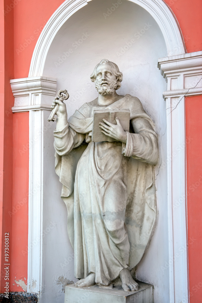 RUSSIA, SAINT PETERSBURG - AUGUST 18, 2017:  Statue of St. Peter in the niche of the bell tower (1812) of Holy Cross Cossack Cathedral in St. Petersburg