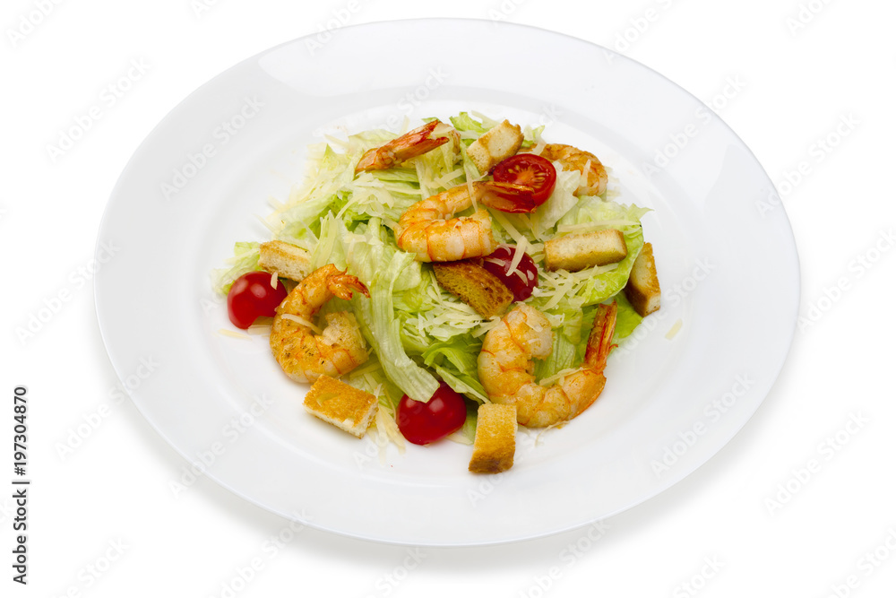 Seafood.Salad with shrimps in a plate on a white background