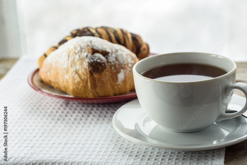 Cup of tea and croissants. closeup Cup of tea and croissants. closeup