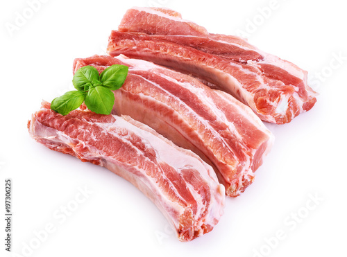 Photography Raw fresh pork ribs and basil isolated on white background.