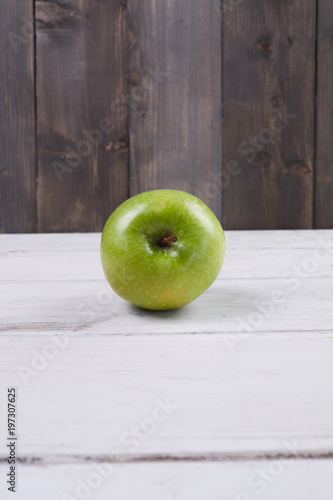 green apple on wooden background