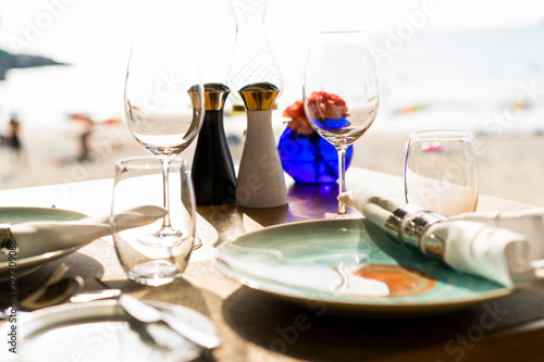 Table set for dining at restaurant at beach