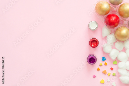 Flat lay top view colorful easter egg painted in pastel colors composition on pink pastel color background. Easter day background top view with copy space.