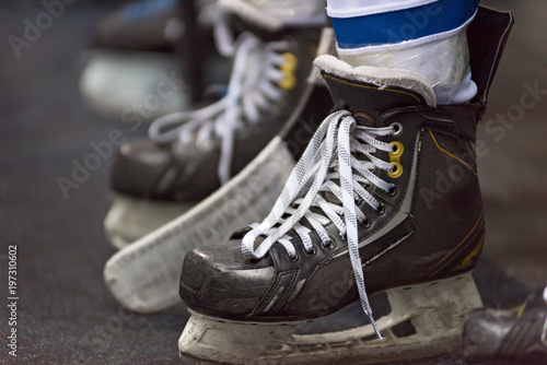 Ice hockey players play ice hockey