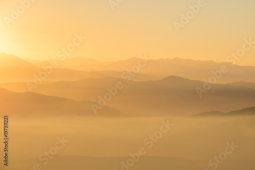 misty sunset on top the mountain