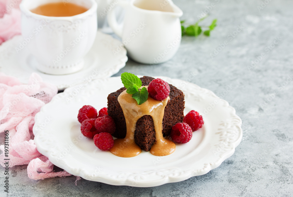 Sticky pudding with caramel sauce and fresh raspberries. Sticky pudding with caramel sauce and fresh raspberries.