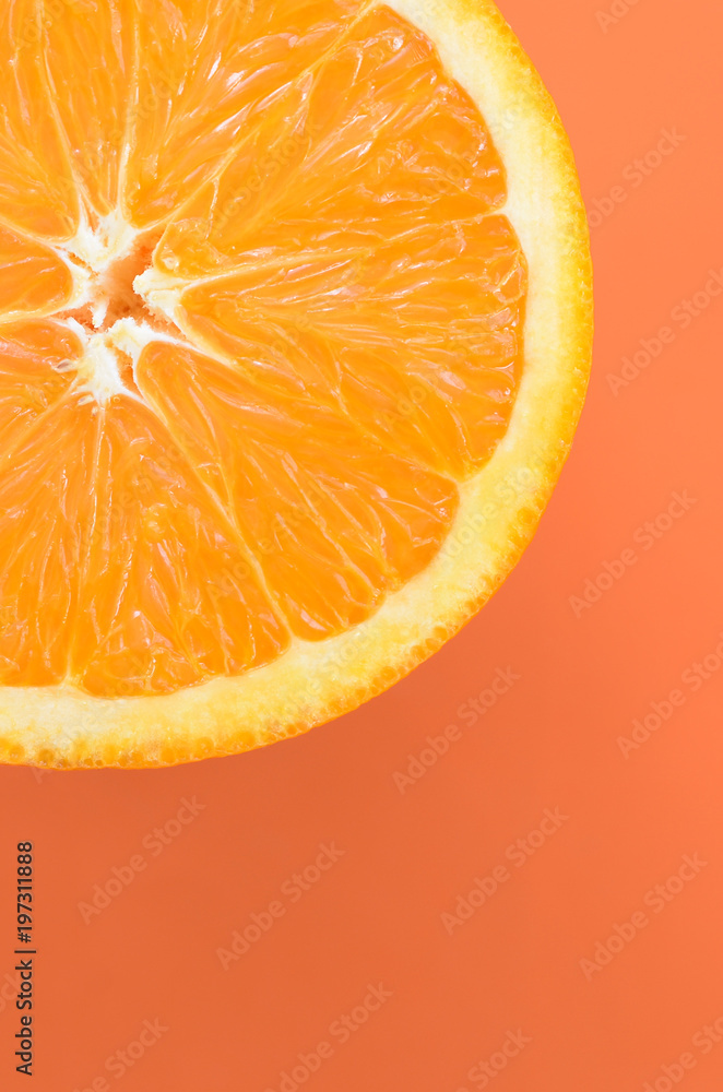 Top view of a one orange fruit slice on bright background in orange color.  A saturated citrus texture image Stock Photo | Adobe Stock