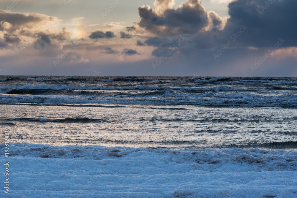 Icy sunset by Baltic sea.