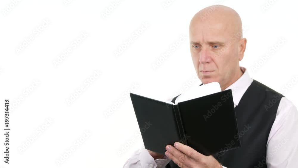 Confident Businessman Reading Financial Documents Confident Businessman Reading Financial Documents