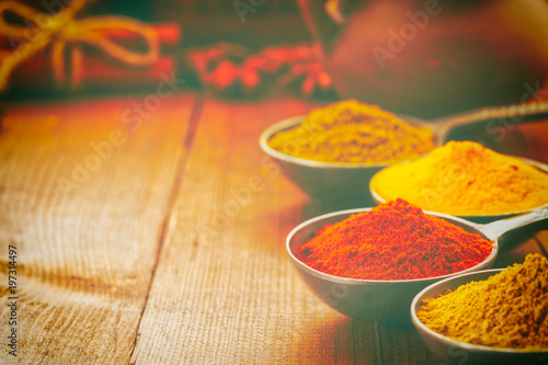 Fototapeta Naklejka Na Ścianę i Meble -  Wooden table of colorful spices