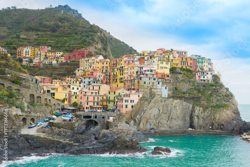 The small traditional Italian village of Manarola with colorful houses now a popular tourist destination in Cinque terre, Liguria, Italy
