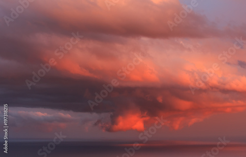 Big red clouds at sunset. Environmental phenomena concept