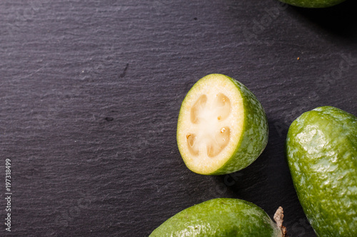 fresh fruits of the feijoa on the rustic background