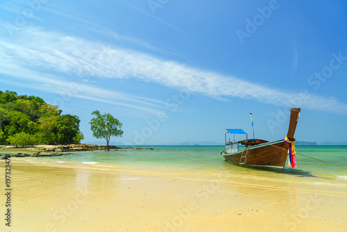 Traditional long-tail boat on the beach © Netfalls