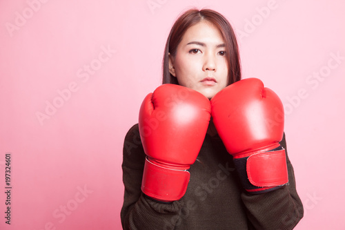 Young Asian woman with red boxing gloves.