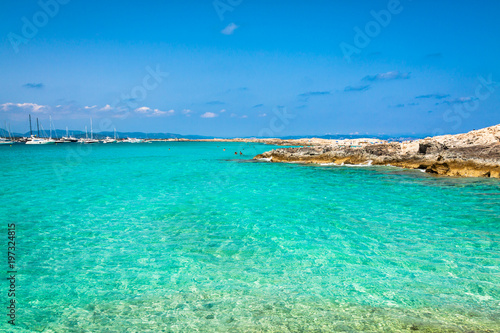 Fototapeta Naklejka Na Ścianę i Meble -  Tourists in Illetes beach Formentera island, Mediterranean sea, Spain