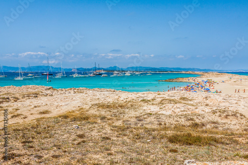 Tourists in Illetes beach Formentera island, Mediterranean sea, Spain