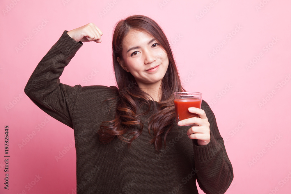 Strong healthy Asian woman with tomato juice. Strong healthy Asian woman with tomato juice.