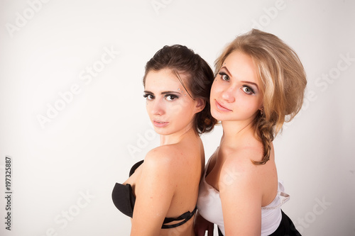 Beautiful young women with glamour make up over white background