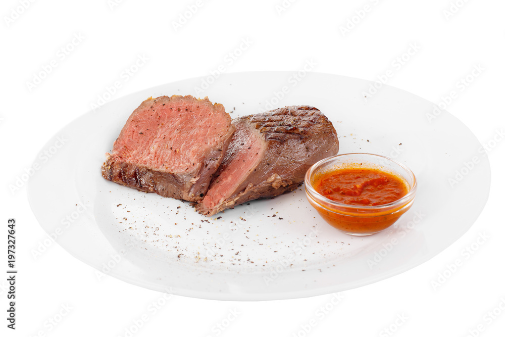 Steak beef, pork, lamb, grilled meat, barbecue, on a plate isolated white background. Tomato, spicy, red sauce. Juicy fillet, medium, strong roast. For the menu in the restaurant, bar Side view