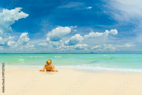WOman alone on the beach in the Caribbean islands
