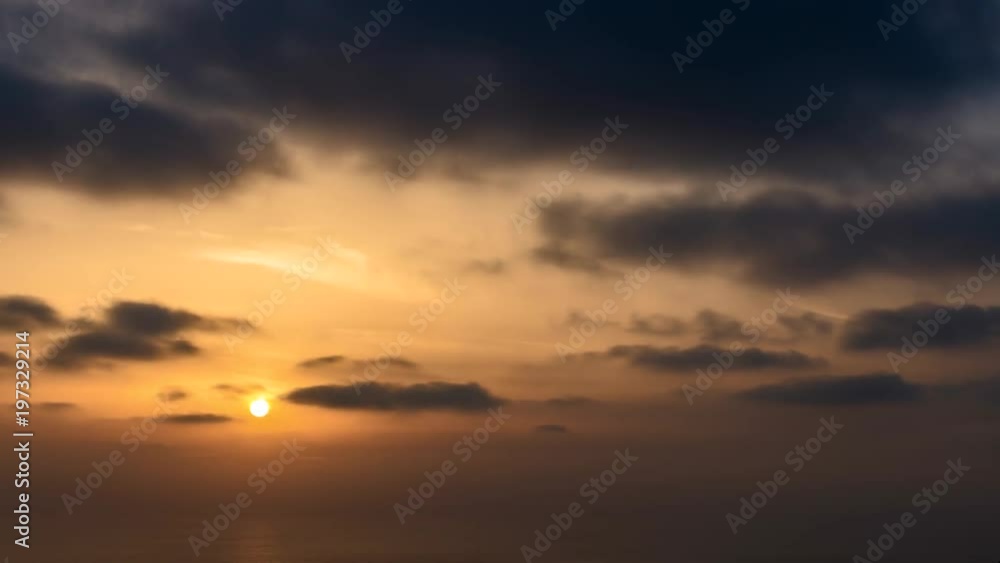 4k time lapse of clouds crossing the amazing sky over the sea or ocean at sunset. transition from day to night. The clouds cross slowly from left to right colored yellow orange purple blue. 4k time lapse of clouds crossing the amazing sky over the sea or ocean at sunset. transition from day to night. The clouds cross slowly from left to right colored yellow orange purple blue.