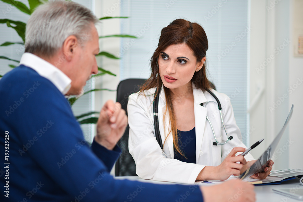 Doctor talking to her patient during a visit